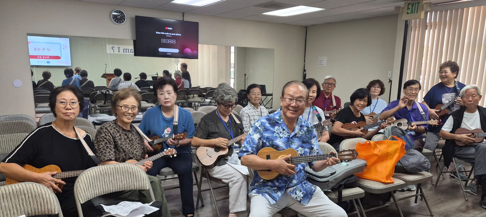 Senior College members playing ukuleles together